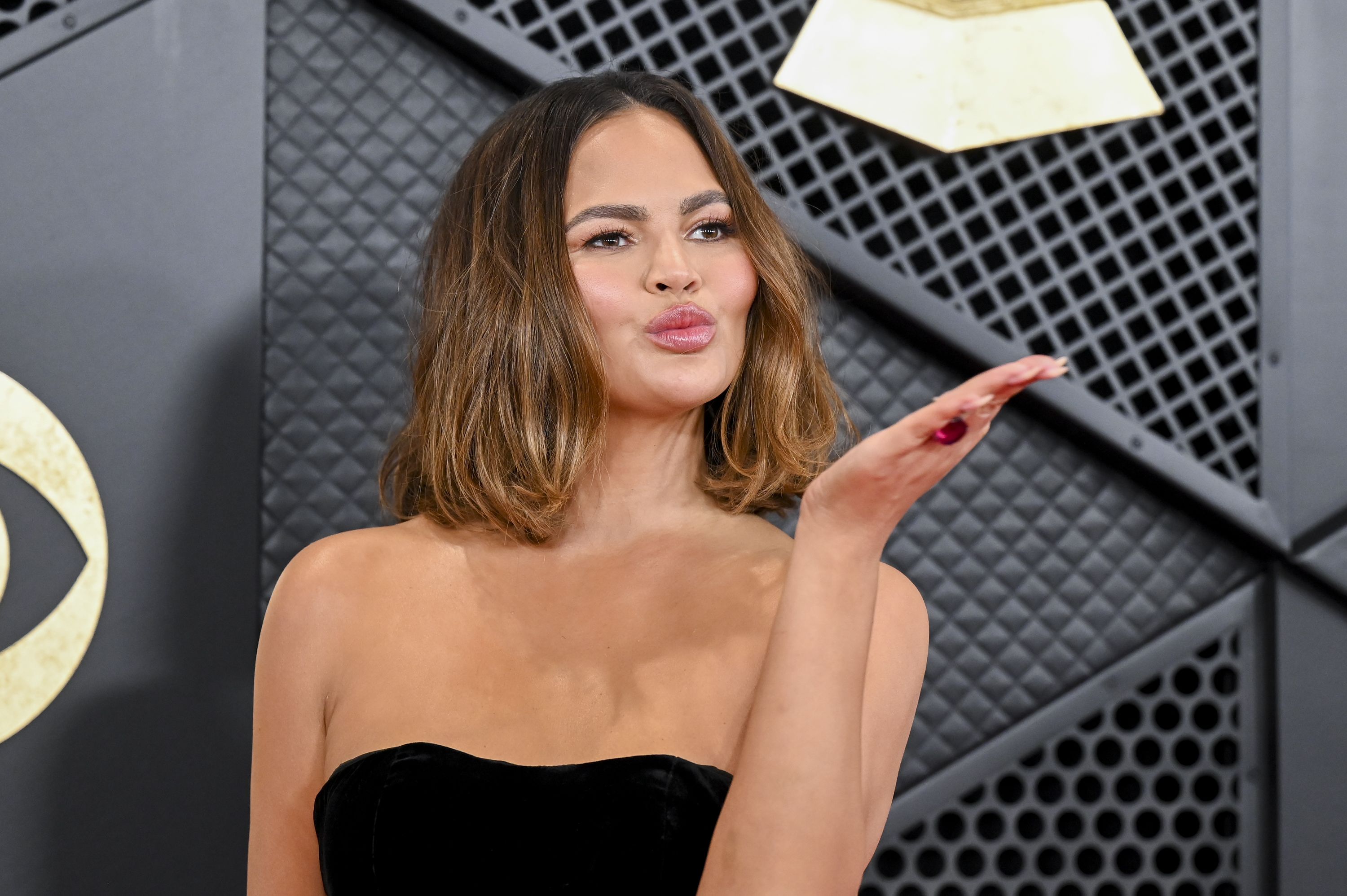 Chrissy Teigen just shared a topless photo showing motherhood in all its  glory