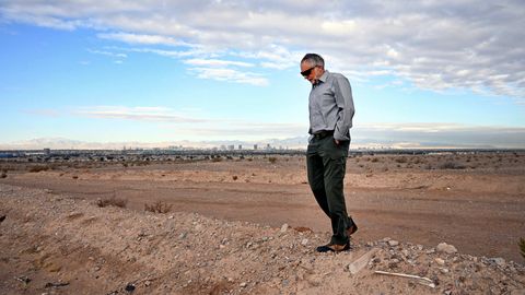 retired environmental scientist christian daughton stands in a desert area overlooking the las vegas strip skyline on tuesday, march 16, 2021 in las vegas daughton is a proponent of wastewater based epidemiology, being able to analyzing sewage to see what it says about public health in the community photo by david becker