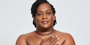 christina miner posing on a white background covering a partial area of their chest showing their scars from surgery
