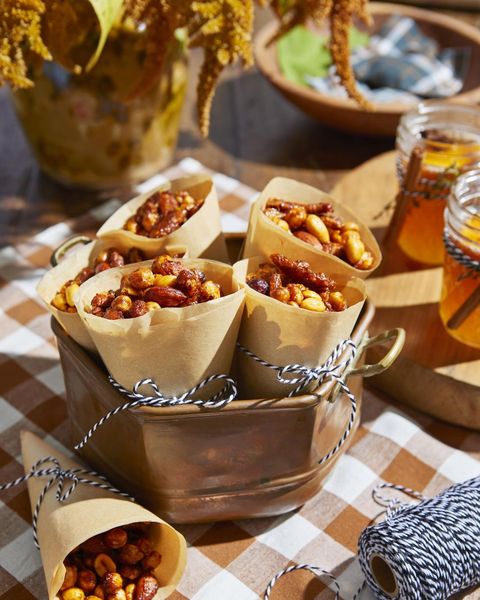 spicy n sweet snack mix in paper cones tied with twine