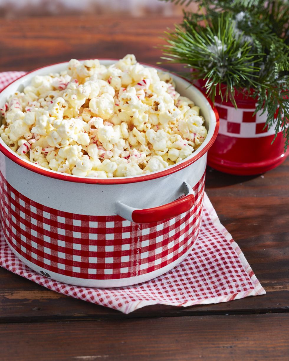 sweet and savory peppermint popcorn in a red and white gingham patterned enamelware pot