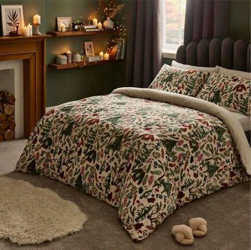 two beds with christmas bedding in cosy bedrooms