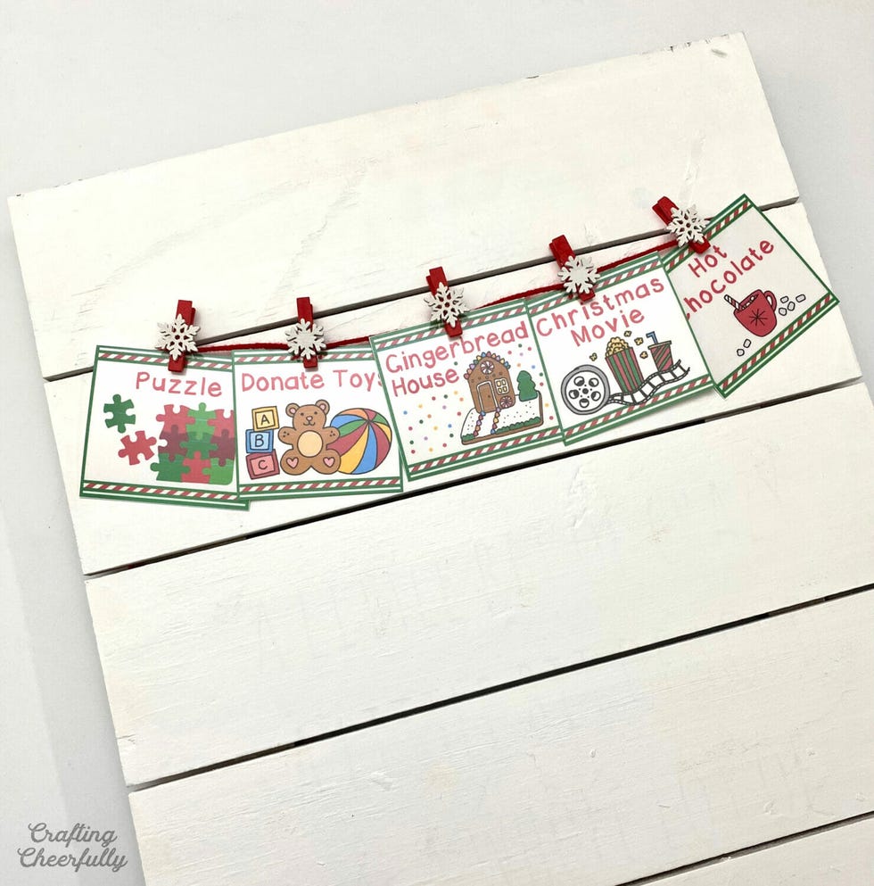 holiday activity cards displayed on a wooden background