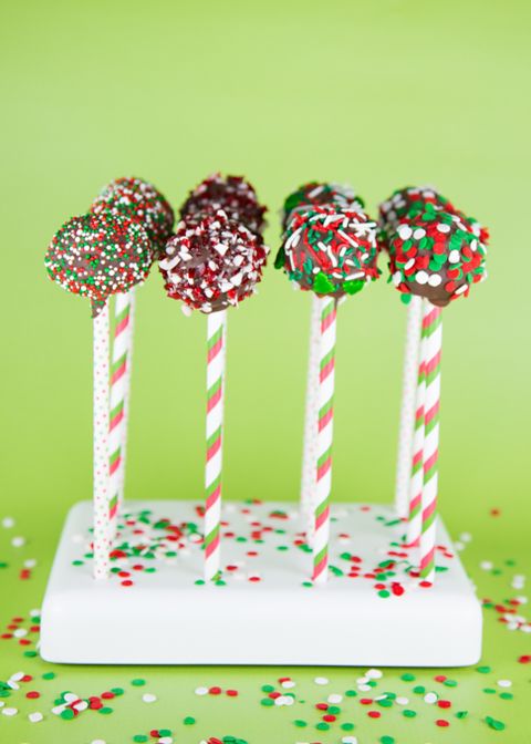 sprinkle cake pops on white stand green background