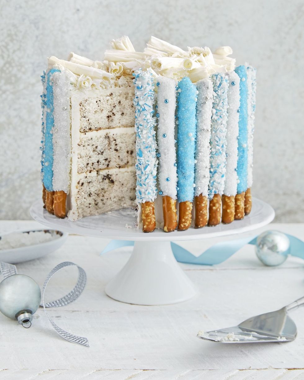 three layer chocolate chip cake decorated with candied pretzels around the outside