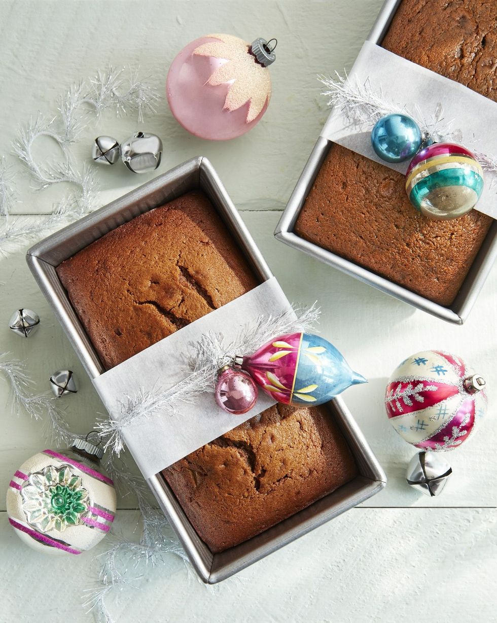 two gingerbread pear loaves in metal loaf pans