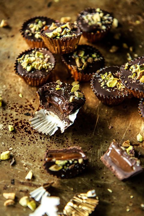 chocolate bourbon caramel cups on gold surface