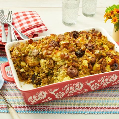 cornbread dressing with sausage and apples in red casserole pan