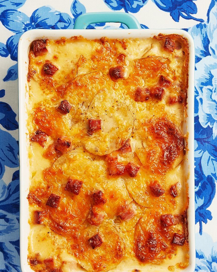 scalloped potatoes and ham on blue floral background