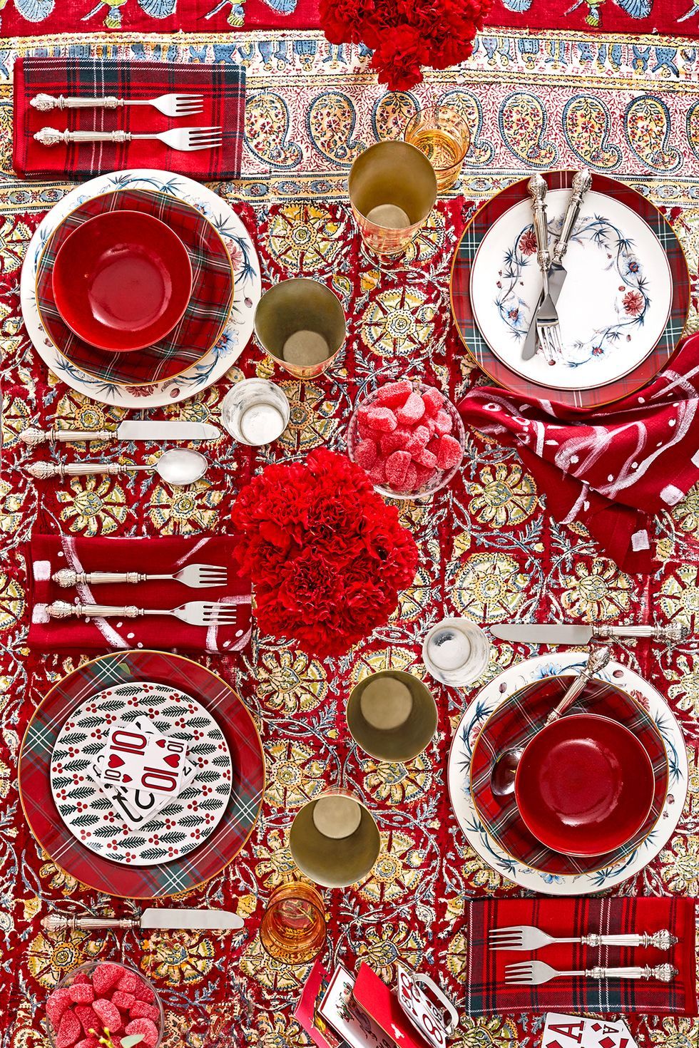 christmas table setting with red tablecloths