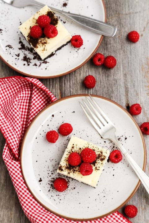 black and white cheesecake bars with raspberries