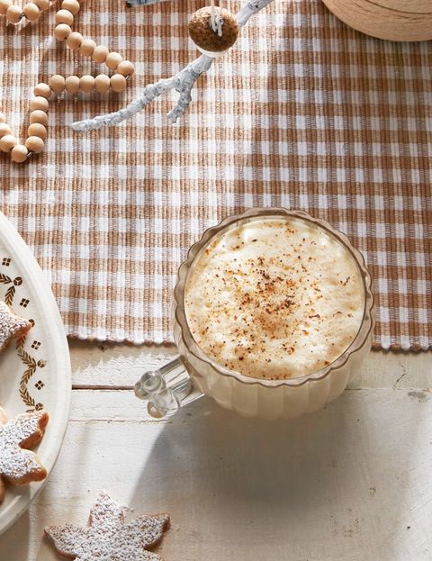 old fashioned eggnog in a glass mug with grated nutmeg on top