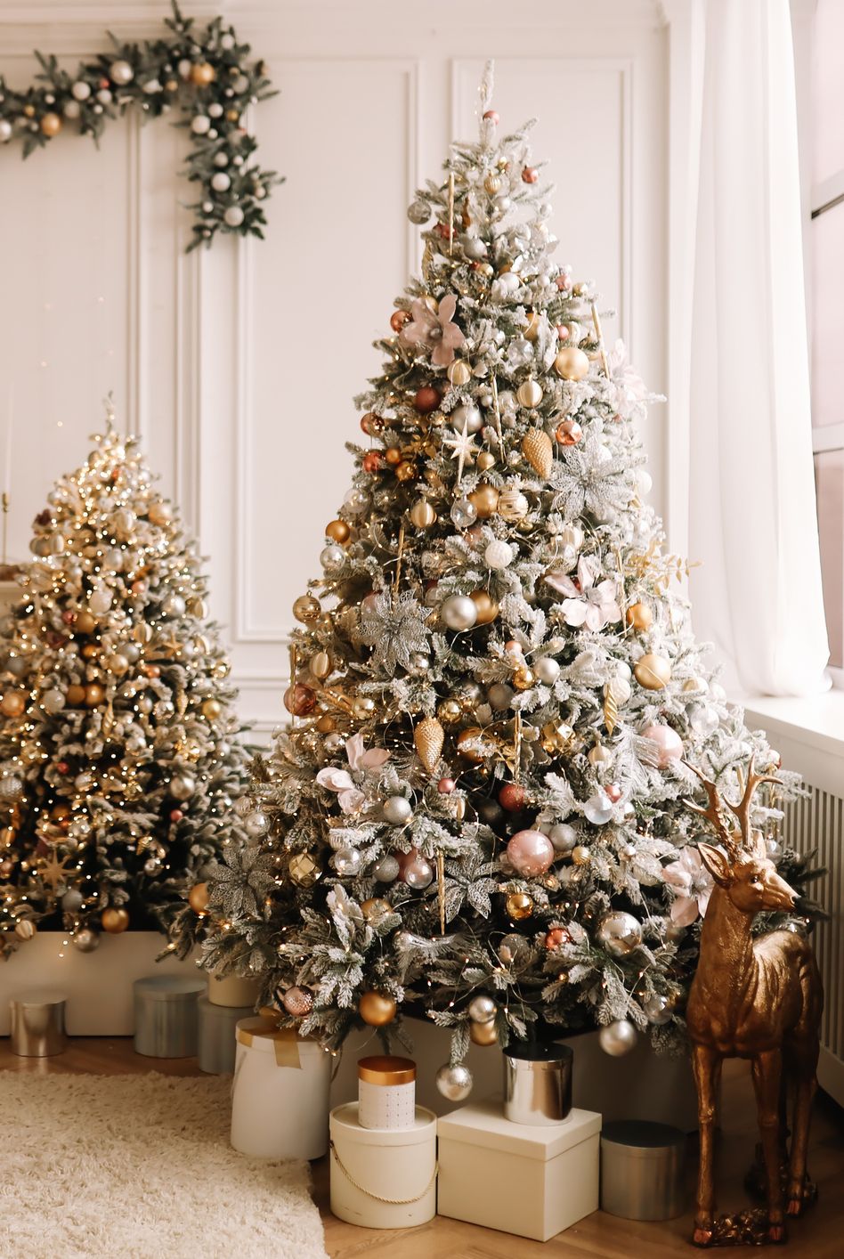 christmas concept festive christmas rich interior in a luxurious modern style with a fireplace and decorated with christmas balls and garlands of christmas trees in a large bright living room in the apartment on new year's eve in winter place for text