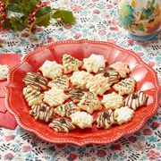 christmas cookie recipes spitz cookies on red plate