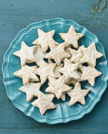 pistachio star cookies on blue surface