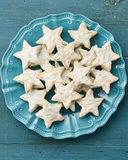 pistachio star cookies on blue surface