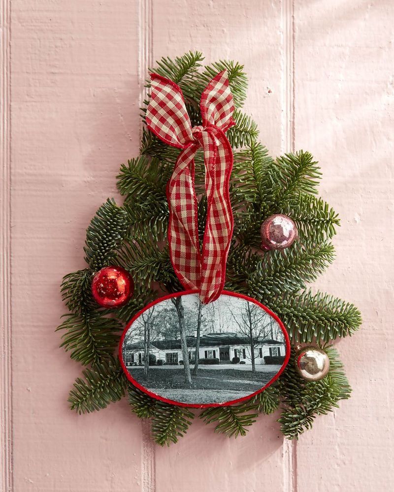 A photo of the house was turned into an ornament surrounded by greenery and small Christmas balls.