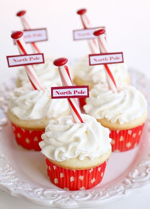 north pole cupcakes in red liners on white plate