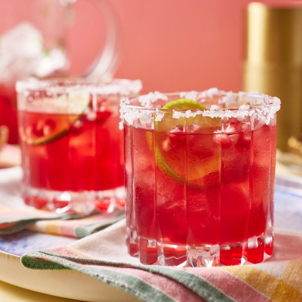 pomegranate margarita with salt rim and lime