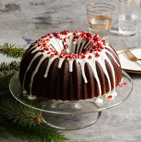gingerbread bundt cake with icing and pomegranate seeds on top