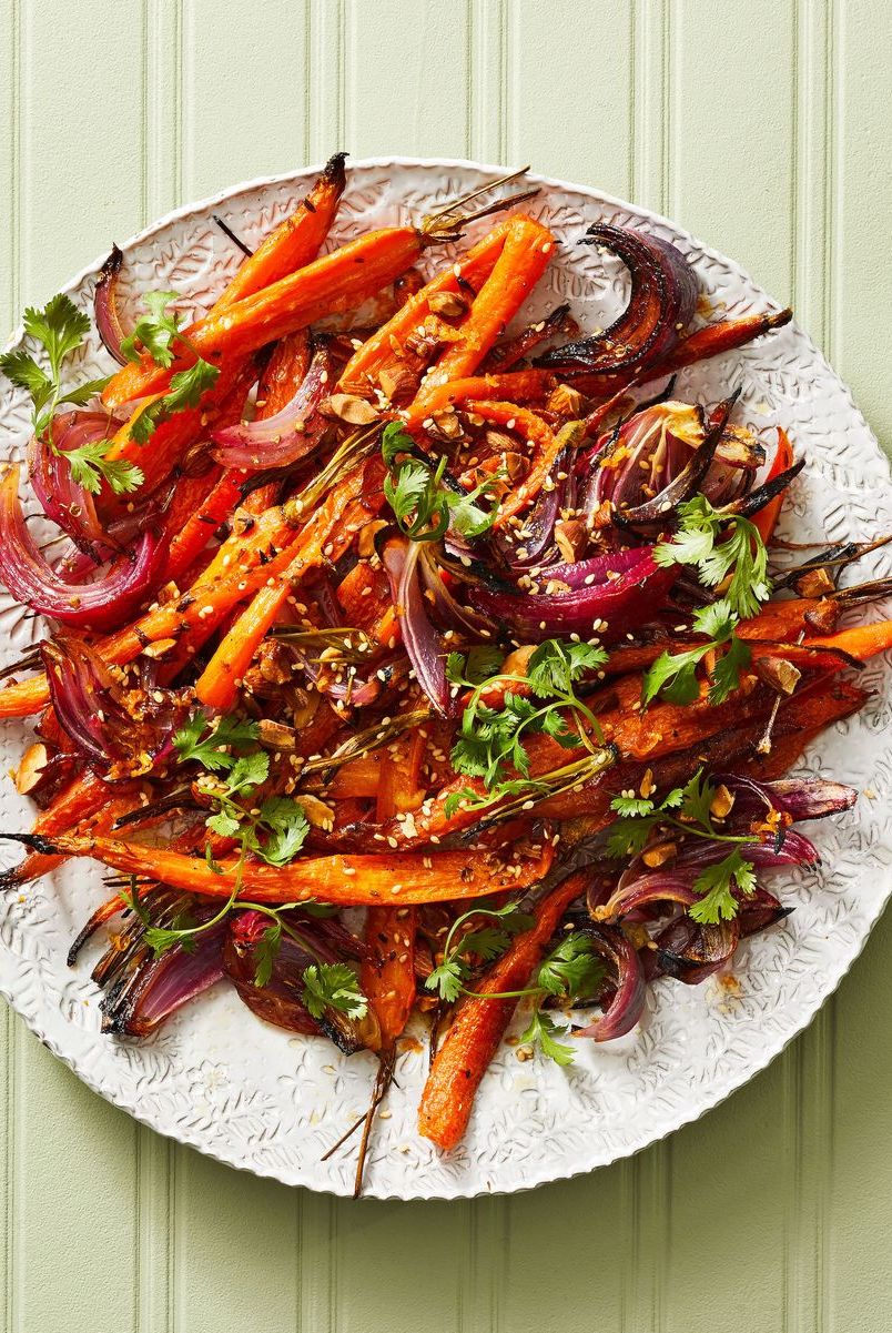 https://hips.hearstapps.com/hmg-prod/images/christmas-dinner-ideas-roasted-carrots-red-onions-6536a51901b8f.jpg?crop=0.670xw:1.00xh;0.131xw,0&resize=980:*