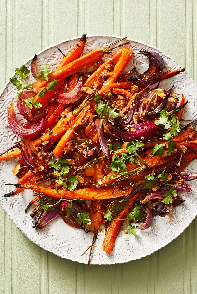 roasted carrots red onion salad on a white plate