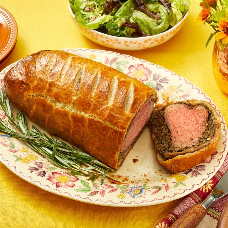 christmas dinner menu beef wellington beef wellington on platter with rosemary