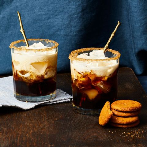 pumpkin spice white russian cocktail with a stack of cookies on the side