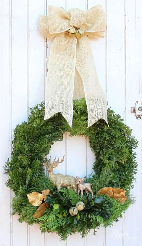 christmas door decorations, evergreen wreath with reindeer figurines in the center