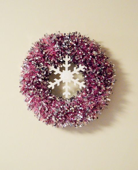 christmas door decorations, wreath made of tinsel  on the wall