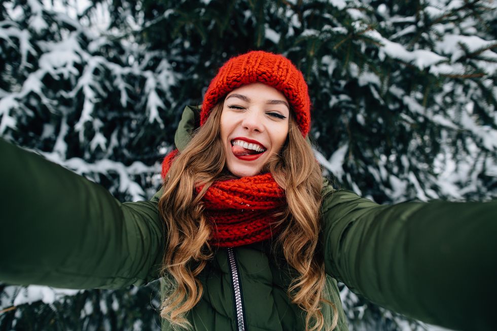 Girl takes funny winter selfie