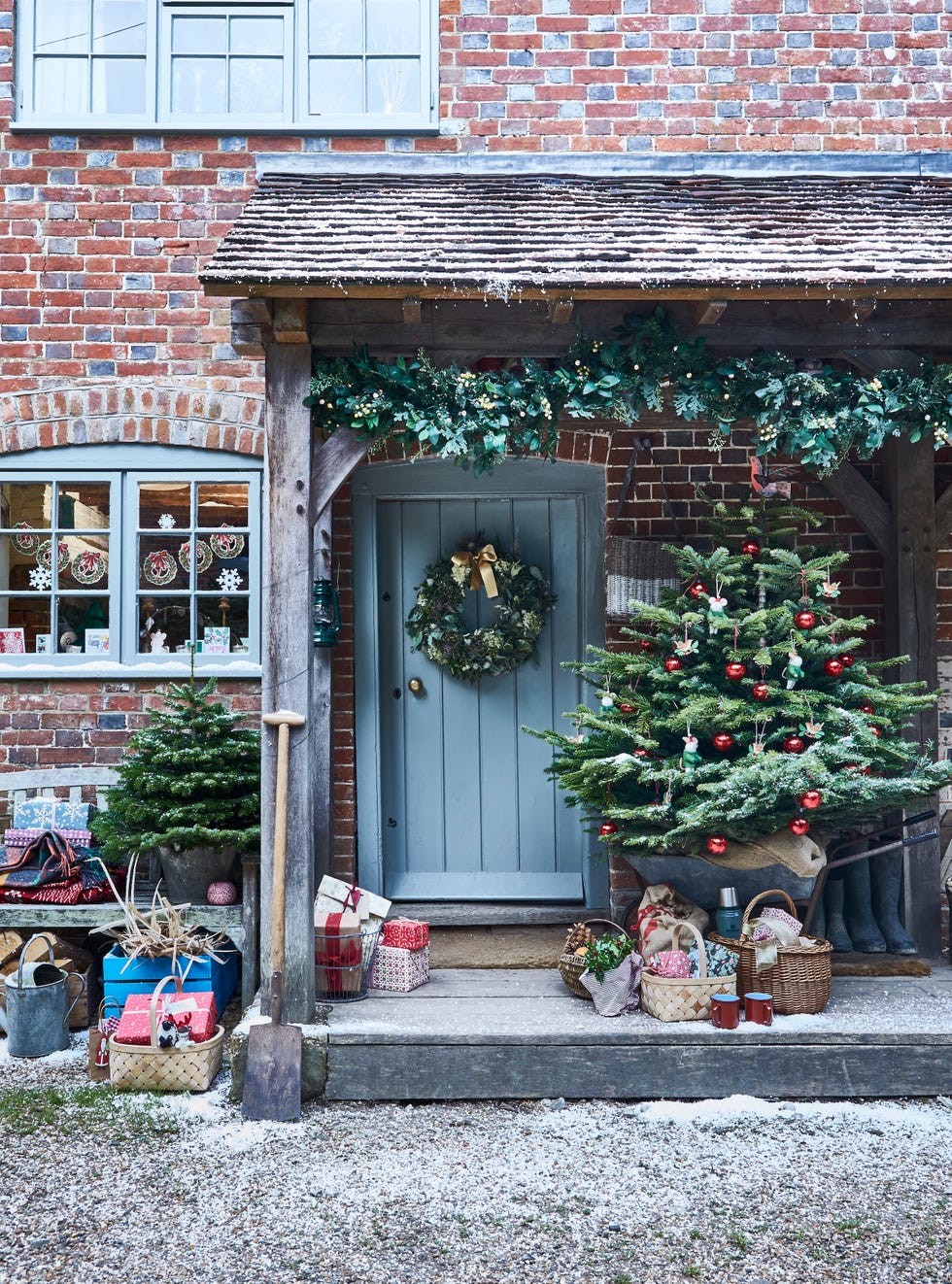 christmas front door with snow on the ground