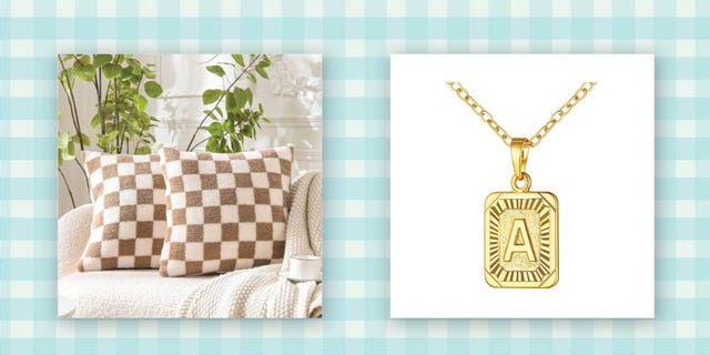 decorative cushions and a gold pendant necklace with an a initial