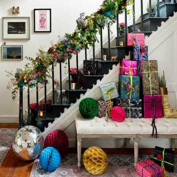 christmas hallway decorations with wreath hanging above mirror