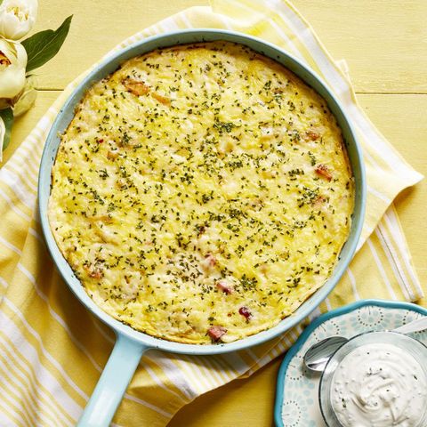ham and cheese frittata with caramelized onions in pan