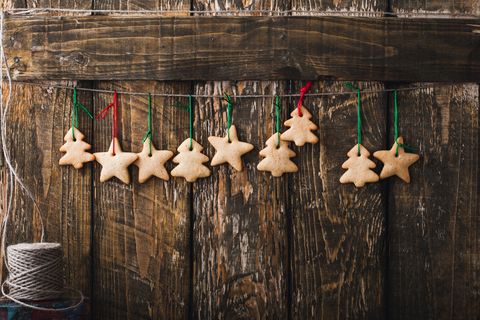 christmas homemade gingerbread cookies on rustic  wooden background with copy space