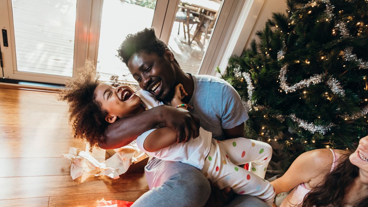 Couple In Love With Gift Having Romantic Christmas Eve Stock Photo