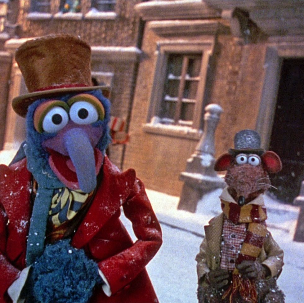 gonzo and rizzo stand in festive garb in a scene from the muppet christmas carol, a good housekeeping pick for best christmas movies for kids