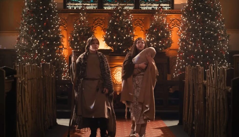 two kids are dressed as mary and joseph on stage in a scene from the best christmas pageant ever