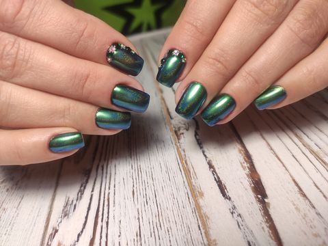 christmas nail art manicure with green nail polish
