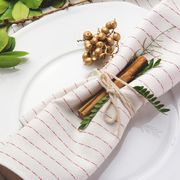 red and white striped napkin on holiday place setting