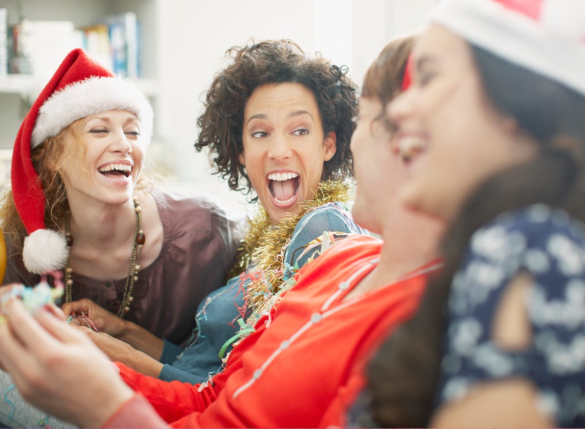 a group of women enjoying a christmas party together