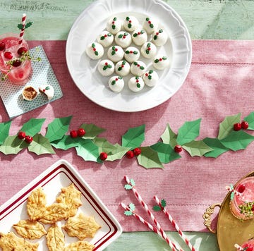 a holly berry themed holiday tablescape