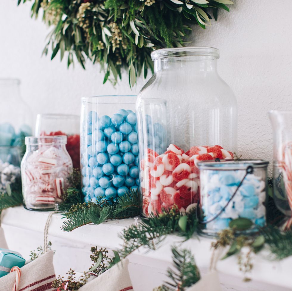 christmas party jars of candy on the mantel