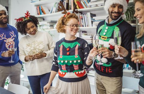 christmas party themes guests wearing ugly sweaters