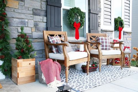 christmas porch decor warm wood seating area