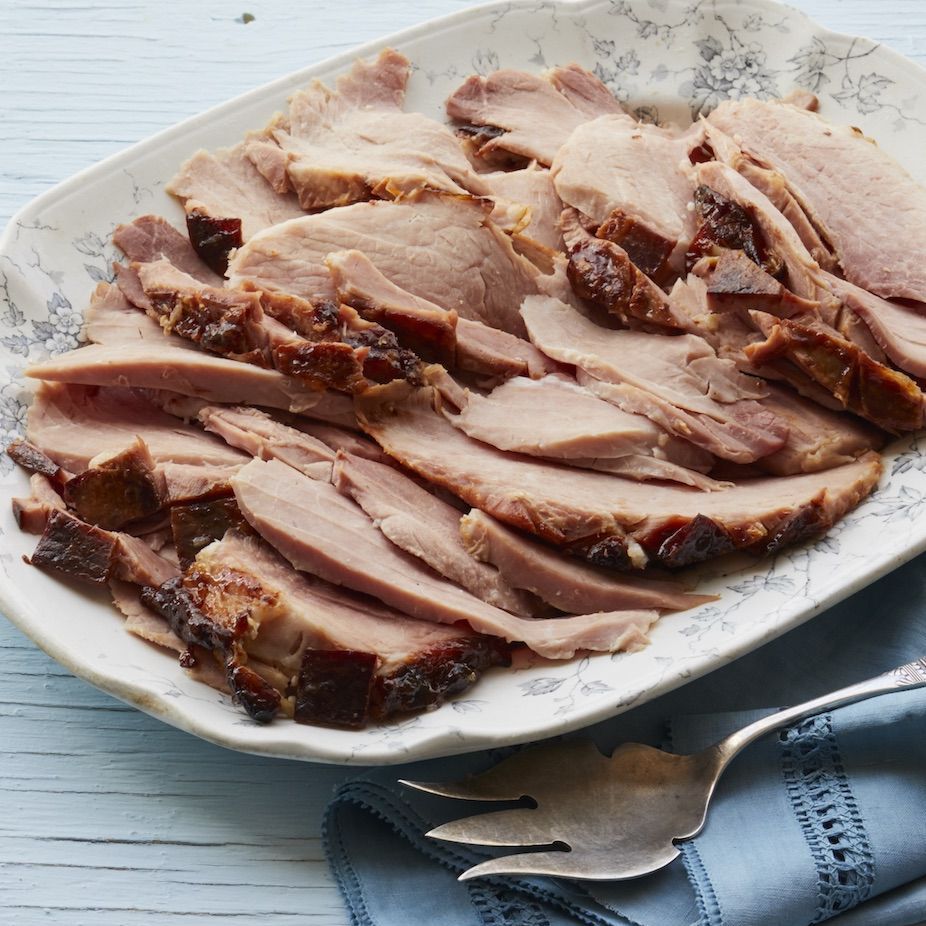 root beer glazed ham on platter with fork