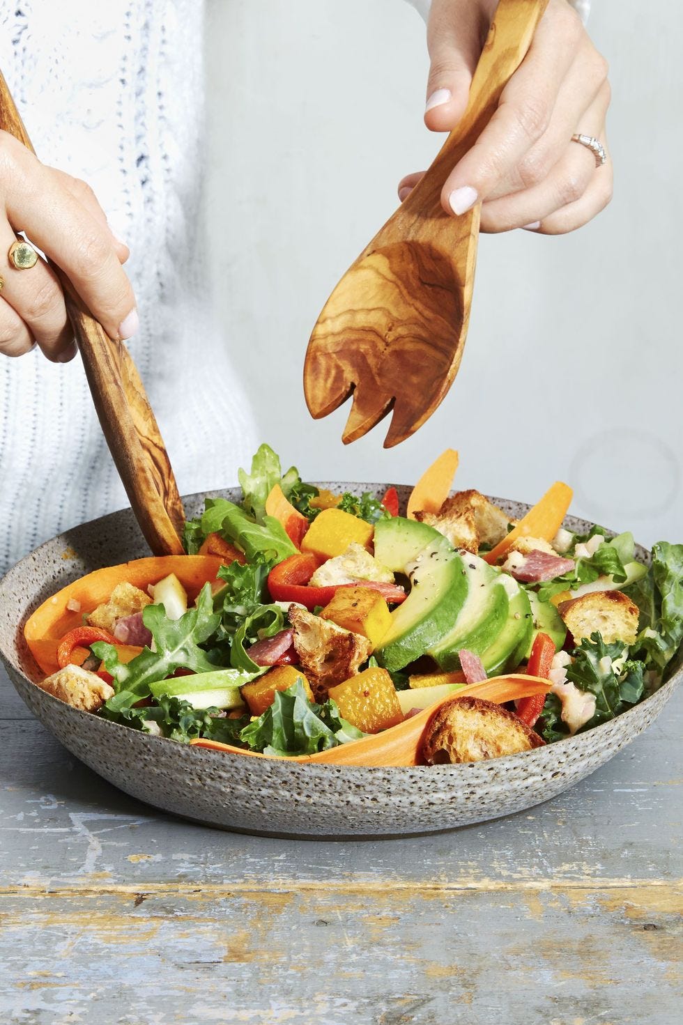 arugula and kale harvest salad with avocado and squash