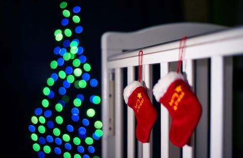 christmas socks hanging on a playpen