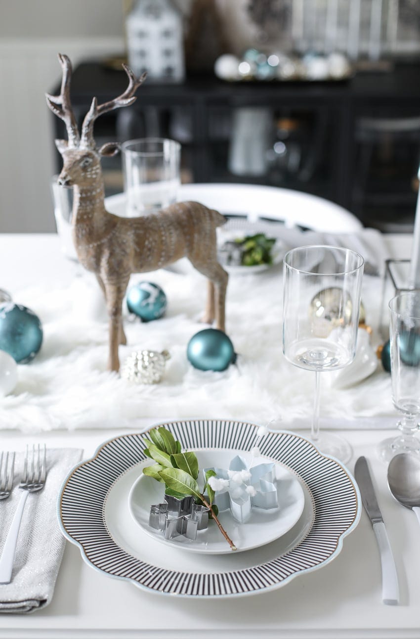 a deer statue on a table